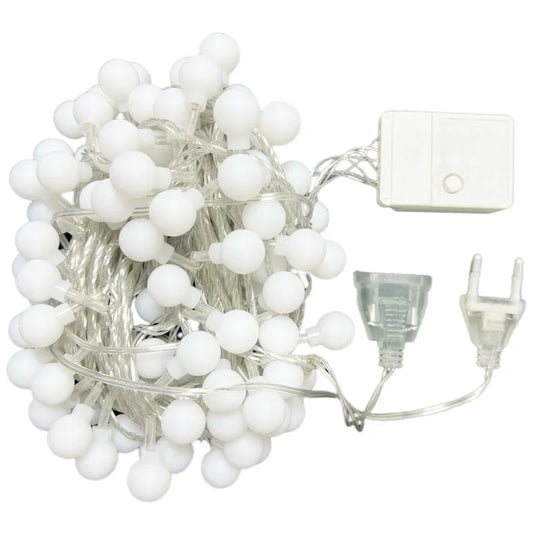 String of white LED lights with a power adapter on a white background