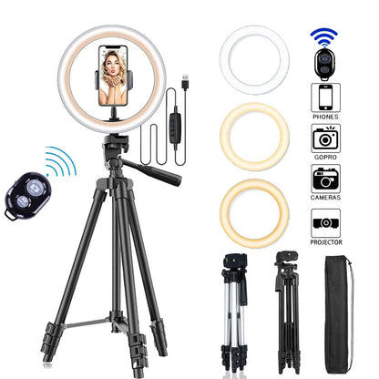Ring light with tripod and remote control on a white background