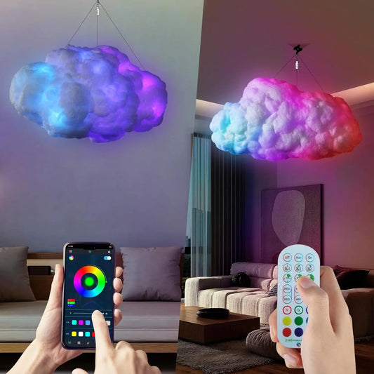Cloud-shaped LED light fixture with smartphone and remote control in a living room setting.