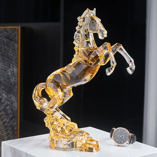 Crystal horse figurine on a white surface with a watch next to it.