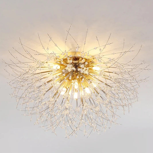 Decorative ceiling light fixture with gold and crystal design on a plain background